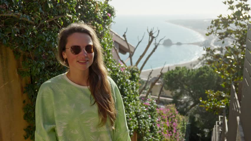 The girl looks back to the beach