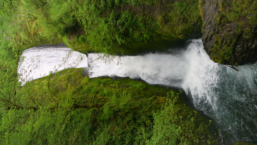 Bridal Veil Falls - A vertical full view of roaring Bridal Veil Falls on a stormy Spring day. Columbia River Gorge, Oregon, USA.