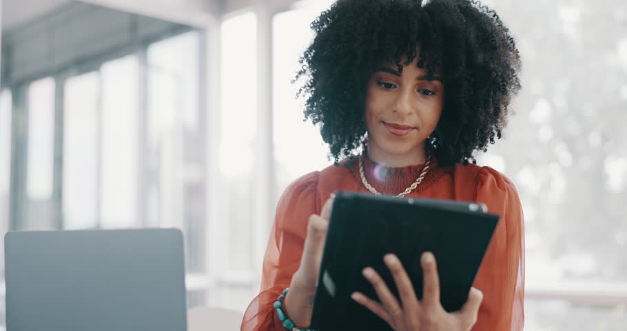 Corporate black woman, office and tablet with smile for communication, email or digital marketing. Business leader woman, digital tech or social media marketing for focus, reading or happy in Toronto | Shutterstock HD Video #1099974183