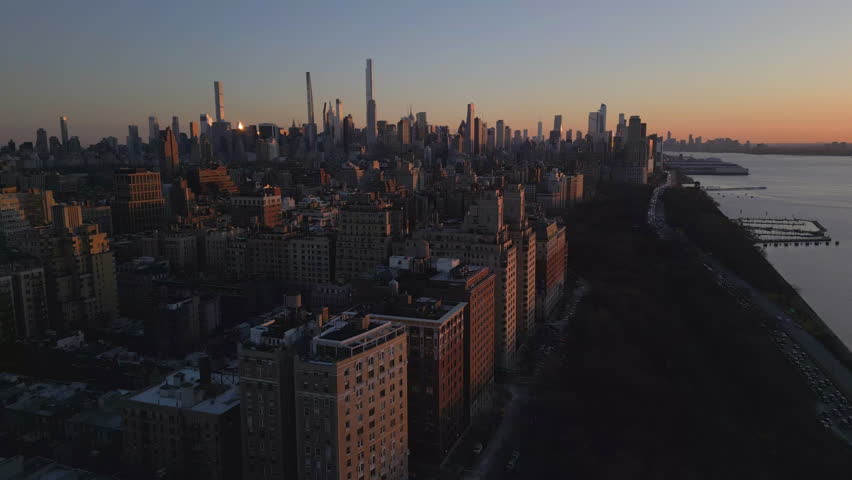 alt sunset descending in Riverside Park NYC revealing Soldiers and Sailors Monument
