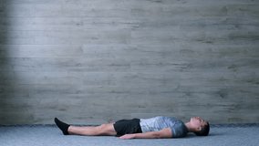 Abs workout videos on a simple wooden background. Leg raises. Plank. Abs twists. Superman. Crnches. Strong core. Losing weight. Follow along workout exercises. How to perform abs exercises.