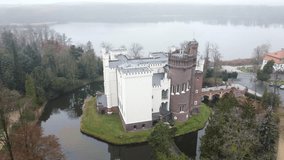 Beautiful castle in the autumn fog close-up from a bird's eye view. Drone video in 4K.