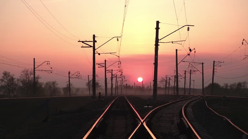 junction of the railway tracks at sunset in the evening. the concept of travel and new tourist destinations. soft focus.
