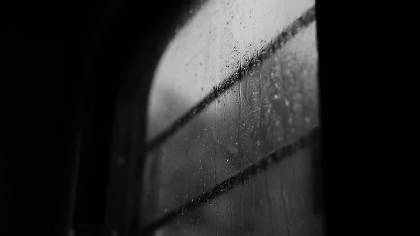 A grayscale view of a wet train window in the rainy weather Royalty-Free Stock Footage #1099996181