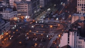 4K time lapse video view from above over Louise intersection during morning rush hour traffic next to passage and tram station in Brussels, Belgium