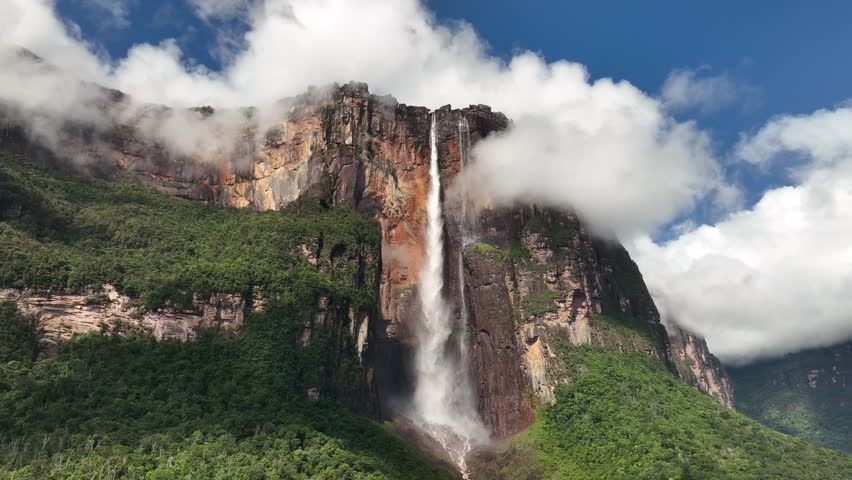 Camera moving closer to Angel Falls in sunlight in Canaima National Park, Venezuela. Royalty-Free Stock Footage #1100009013