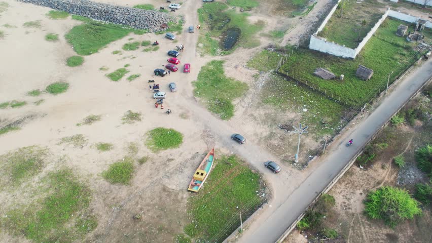 Cars driving toward a beach close to Chennai.