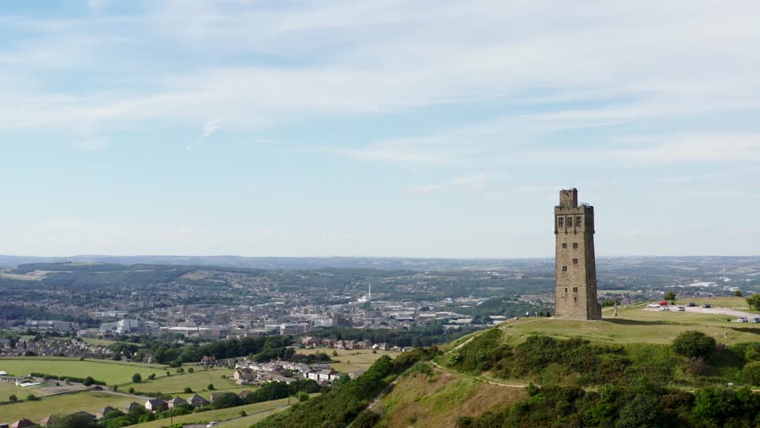 Drone fly past of Victoria Tower on castle hill in Huddersfield towards the town centre