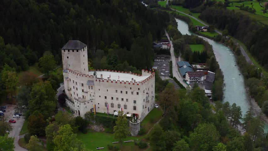 Aerial View Of Castle Bruck Beside River Isel In Austria. Parallax Shot 