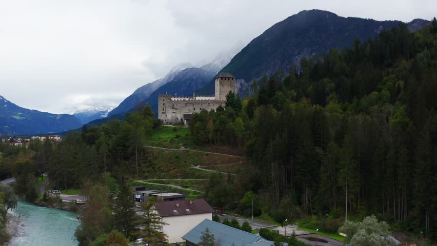 Aerial View Of Castle Bruck Beside River Isel In Austria. Slow Ascending Shot