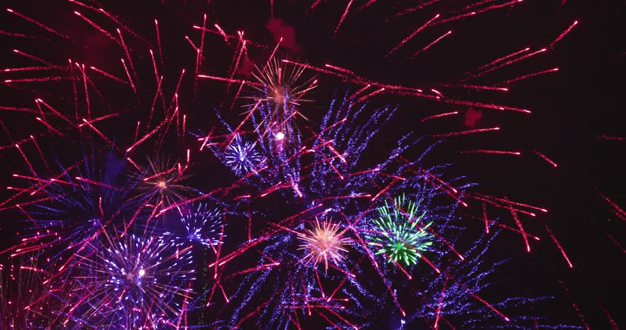 Fireworks at night after celebration. The colors are red, blue and green | Shutterstock HD Video #1100016013