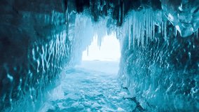Frozen winter lake Baikal, Siberia, Russia. Ice icicles and blocks in the rocks, grottoes and caves at dawn. Natural background of cold ice. Winter abstract background. High quality 4k footage - Powered by Shutterstock - Get 15% off with code: PIKWIZARD15