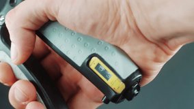 A close up shot of a man hand squeezing a arm clamp trainer, 4K video, fitness sport 2