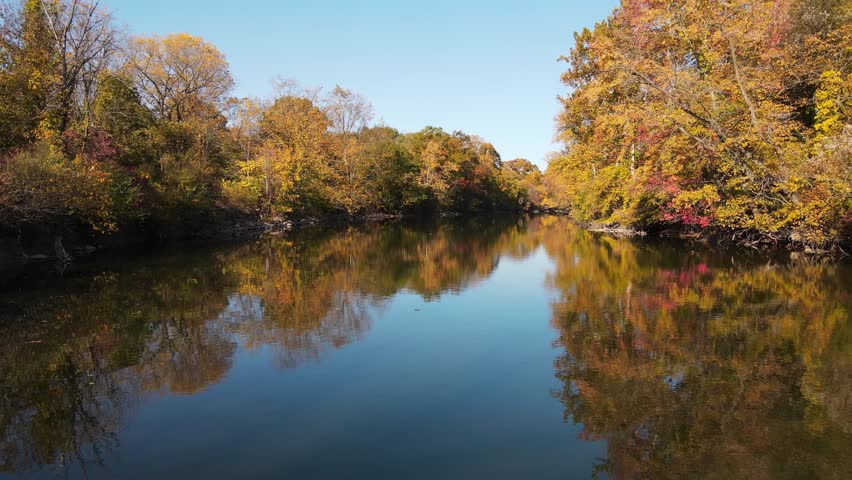 Huron River in Oakwoods Metro Park, Wayne County Michigan with colorful trees on banks