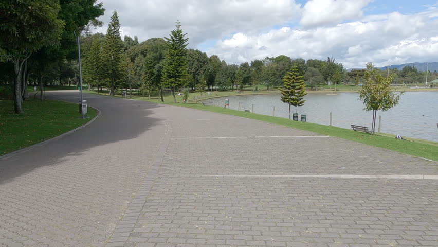 Video recorded with a moving camera on a path in Simón Bolívar Park in Bogota, the largest central park in the city