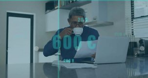 Animation of financial data processing over senior biracial man using laptop. Global business, finances and digital interface concept digitally generated video.
