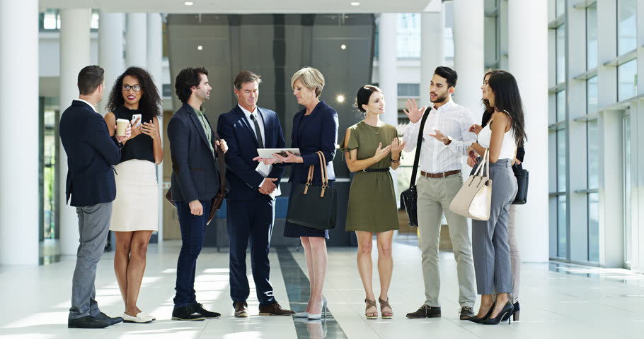 Communication, diversity and business people at networking event talking, discussion and speaking about economy growth. Team business meeting, company lobby and employee group chat about global sales | Shutterstock HD Video #1100029271