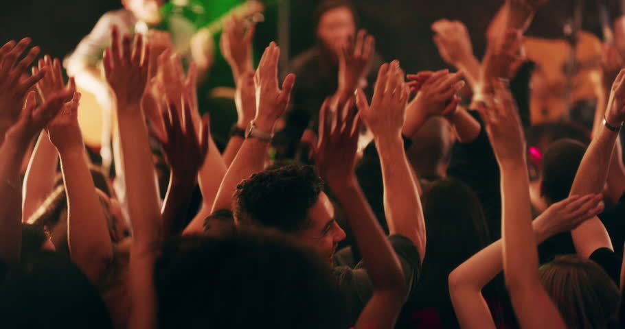 What the crowd wants the crowd gets. 4k video footage of a crowd of people cheering and dancing during a live musical performance. | Shutterstock HD Video #1100029327