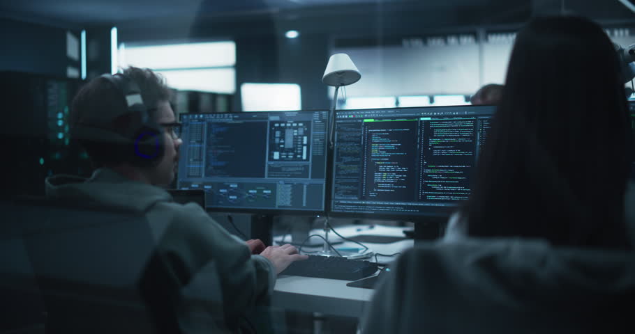 Team of Talented Young Professionals Working in a Technological Research and Development Agency. Computer Screens with Software Code and Technical Neural Network Diagrams