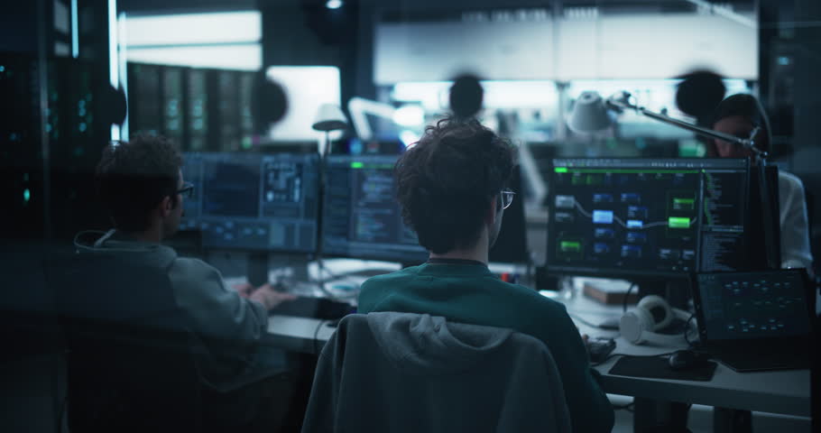 Group of Multicultural Men and Women Working in a Research Center, Collaborating and Discussing a Project, Using Computers to Write Advanced Software Code, Develop Artificial Intelligence Service Royalty-Free Stock Footage #1100036245