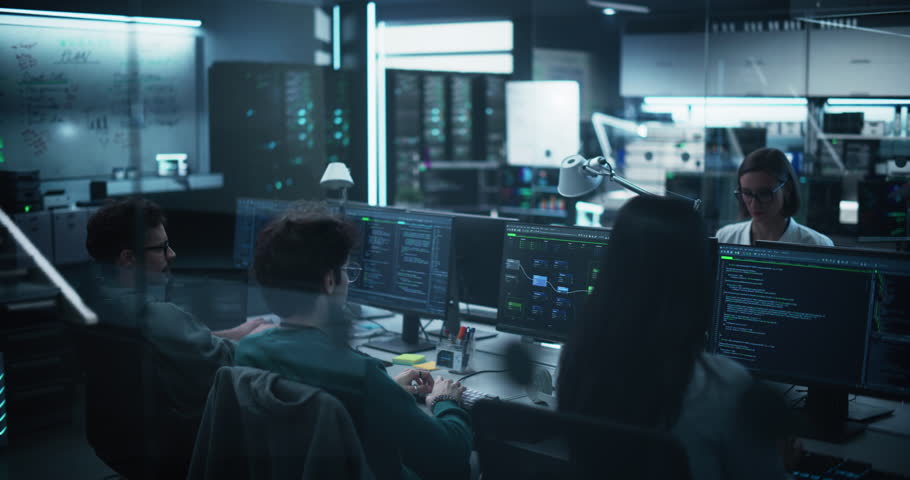 Team of QA Engineers Find and Fix Bugs in a Product or Program Before the Launch, Collaborating and Talking with Colleagues. Young Specialists Working in Advanced Technology Industry