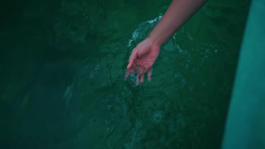 Top-down view from a moving boat. A woman