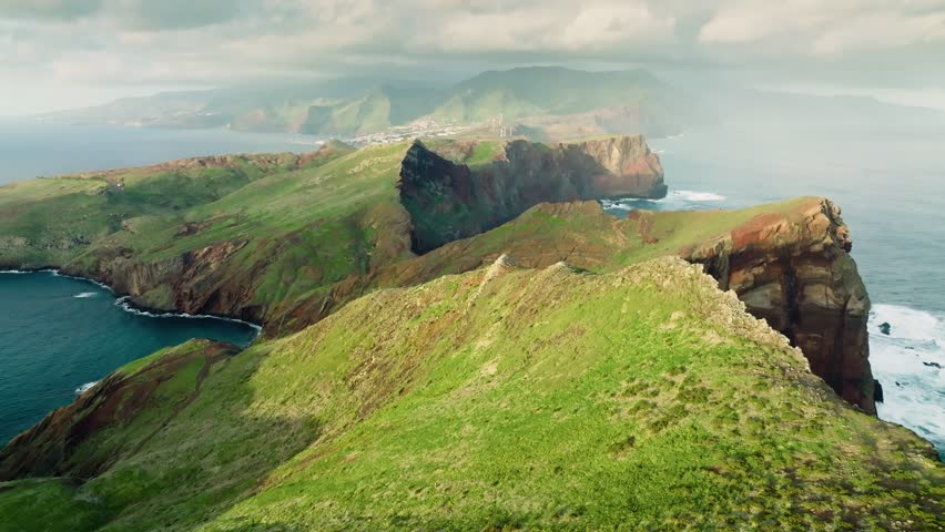 Aerial view of Ponta de Sao Lourenco at sunrise, Madeira island, Portugal. Beautiful landscape of Madeira island. Brown-green rocks in the ocean - Madeira easternmost point Royalty-Free Stock Footage #1100045785
