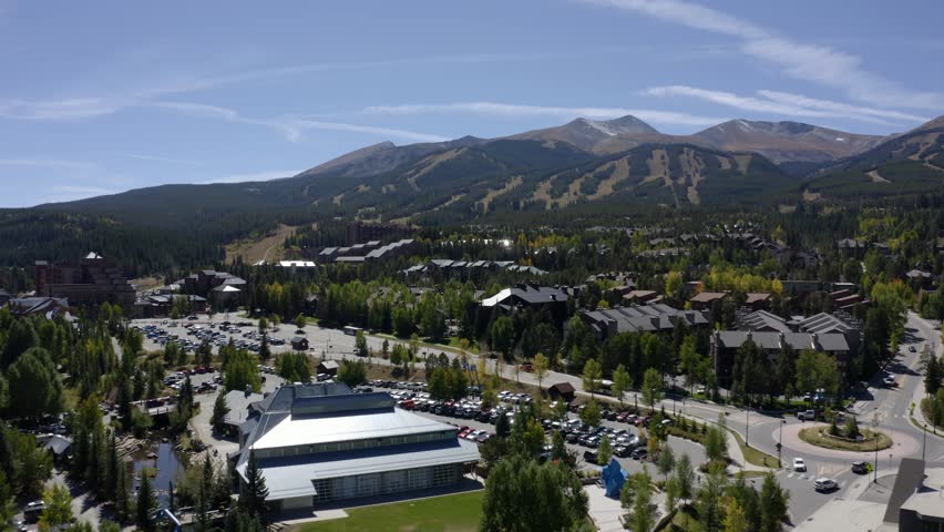 Aerial view over streets and buildings, towards mountains, sunny, fall day in Breckenridge, Colorado, USA