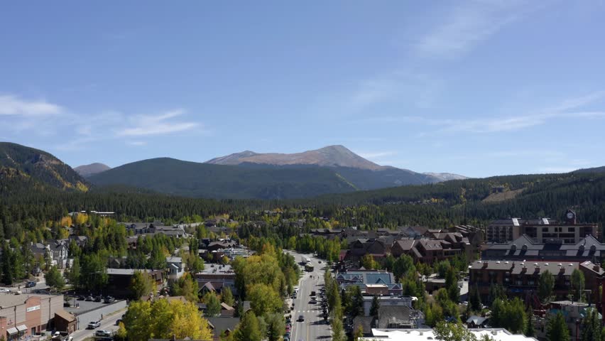 Aerial view tilting over traffic on the streets of Breckenridge, sunny, fall day in Colorado, USA