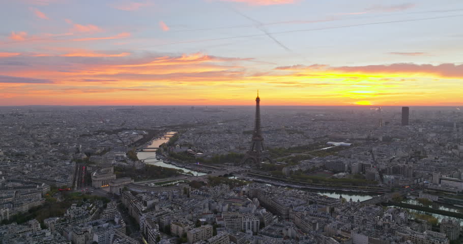 Beautiful view of famous Eiffel Tower in France with colorful twilight romantic sky. Wide establishing aerial morning sunrise or sunset of paris city center best travel destinations landmark in Europe Royalty-Free Stock Footage #1100047821