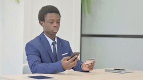 African Businessman making Successful Online Payment on Smartphone - Powered by Shutterstock - Get 15% off with code: PIKWIZARD15