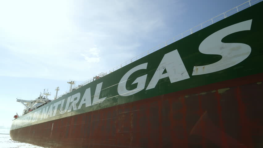 Green side of a huge tanker. Ship powered by natural gas. LNG big tanker Royalty-Free Stock Footage #1100049863