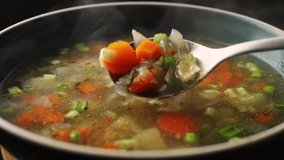 Homemade chicken vegetable soup cooking, close up view of chef cooking vegan healthy soup in big pan pot. - Powered by Shutterstock - Get 15% off with code: PIKWIZARD15