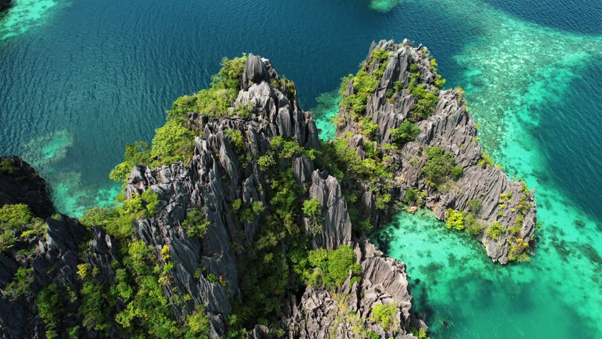 4k Drone Circles Karst Cliffs at Twin Lagoon, Coron, Palawan Philippines Royalty-Free Stock Footage #1100064735