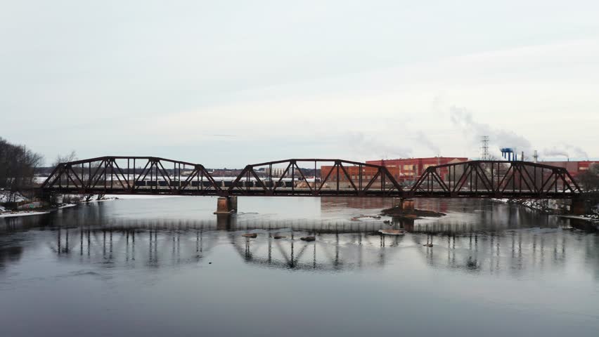 Aerial, frozen Wisconsin River, revealing downtown Stevens Point during winter