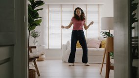 Young asia people Gen Z woman enjoy relax happy fun moving in new home. Humor laugh smile listen music funny dance crazy joy playing with cute puppy pet dog at cozy sofa life balance in youth culture. - Powered by Shutterstock - Get 15% off with code: PIKWIZARD15