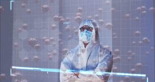 Animation of covid 19 cell and data over caucasian male medic in ppe suit. global covid 19 pandemic, healthcare services and data processing concept digitally generated video.