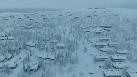 Drone shot of small village Saariselka in Finland in winter. Sami village. Urho Kekkonen National Park. Kaunispää Triangulation Tower. Ski resorts. Walk in Saariselka. Frozen trees in Finland. Sunset. - Powered by Shutterstock - Get 15% off with code: PIKWIZARD15