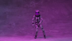 An astronaut in a spacesuit dances disco in a nightclub. Purple blue flashing neon light. 3d animation of seamless loop - Powered by Shutterstock - Get 15% off with code: PIKWIZARD15