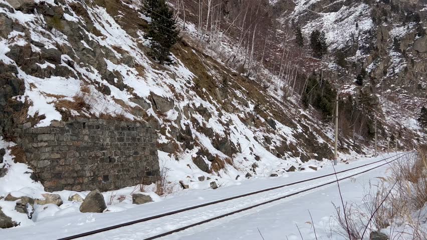 Tunnels and bridges winter circum-Baikal railway at the foot of the mountains on the coast of Lake Baikal, Siberia, Russia. High qualty 4k footage