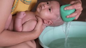 Cute Asian baby bathing video