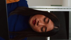 Vertical video: Female employees doing financial planning on laptop, checking products for supply chain management. Owner and female worker analyzing logistics data on pc, business development. - Powered by Shutterstock - Get 15% off with code: PIKWIZARD15