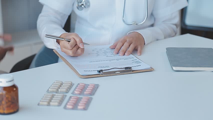 Male Doctor writing out RX prescription, copy space, consent contract sign prescribe a remedy healthy lifestyle healthcare Online medical service concept | Shutterstock HD Video #1100084207