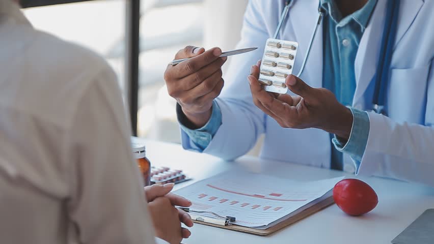 Male Doctor writing out RX prescription, copy space, consent contract sign prescribe a remedy healthy lifestyle healthcare Online medical service concept | Shutterstock HD Video #1100084275