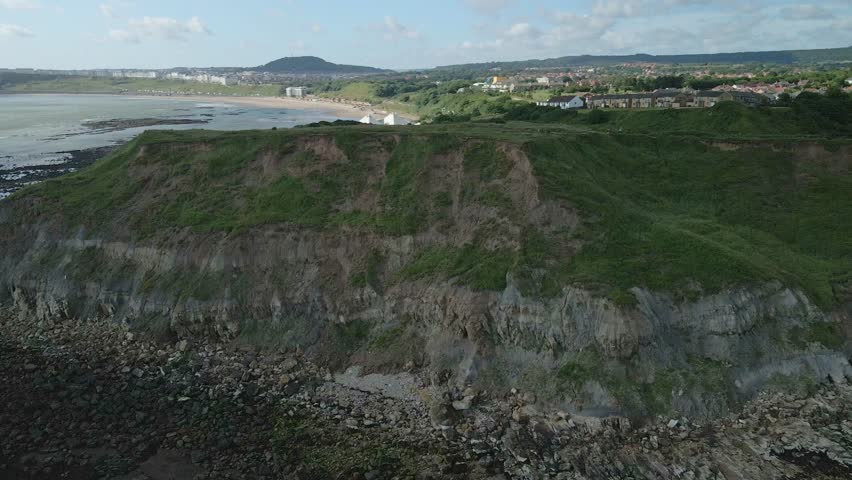 Aerial view of North bay, Scarborough, North Yorkshire with cliffs, coastline, ocean, and castle