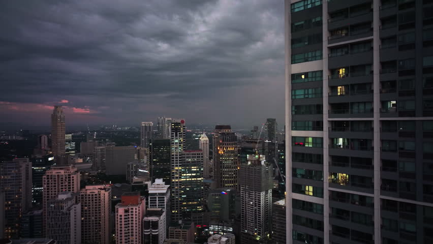 Flying Over The Evening Glowing Manila, Philippines