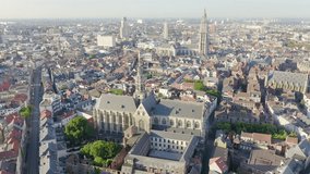 Inscription on video. Antwerp, Belgium. St. Paul s Cathedral (Sint-Pauluskerk). Different colors letters appears behind small squares, Aerial View, Point of interest