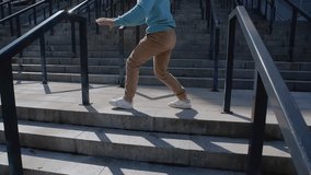 Acrobat performing parkour tricks on the stairs of modern stadium. Caucasian guy in beige trousers and white T-shirt jumping over the metal railings of the parapet
200 fps slow motion - Powered by Shutterstock - Get 15% off with code: PIKWIZARD15
