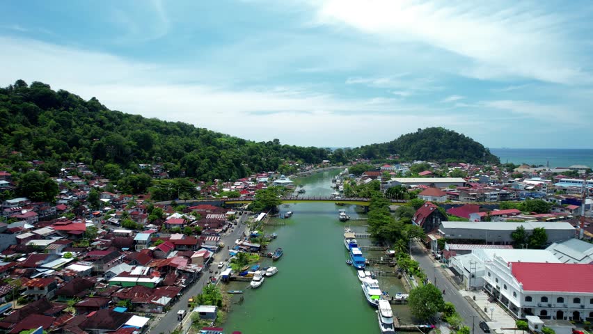 Aerial view of the Batang Arau river and Siti Nurbaya Bridge in Padang City, West Sumatra, Indonesia.