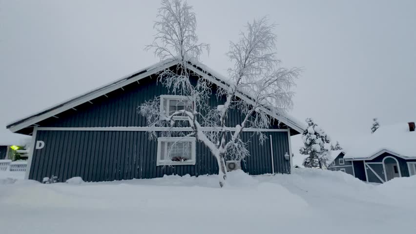 Shot of the small village Saariselka in Finland in winter. Sami village. Urho Kekkonen National Park. Kaunispää Triangulation Tower. Ski resorts. Walk in Saariselka. Frozen trees in Finland. Sunset.